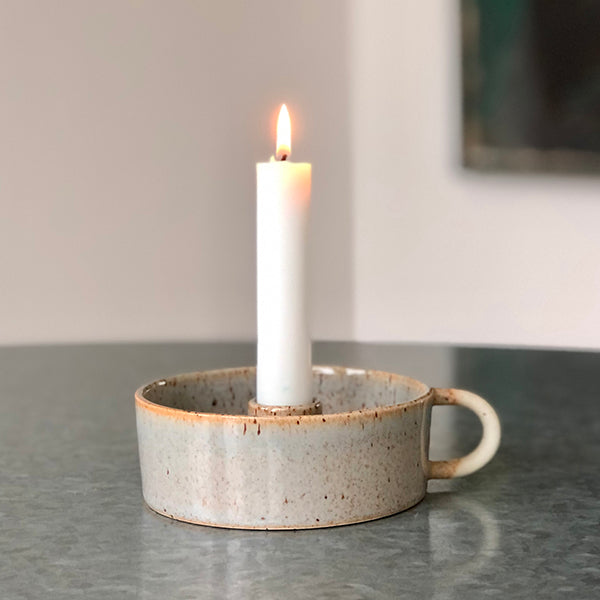 Candleholder with a handle